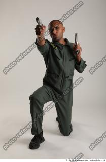 01 2018 01 ERIC KNEELING POSE WITH GUNS